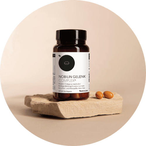 Die Produktdose von Nobilin Gelenk Complex® auf einem Steintablett